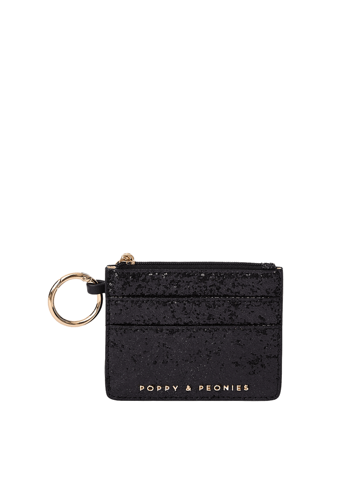 Poppy and Peonies Twinkle Card Holder Black featuring a compact rectangular silhouette, shimmering black textured exterior, multiple horizontal card slots, gold-tone keyring attachment, and gold Poppy and Peonies logo near the bottom.