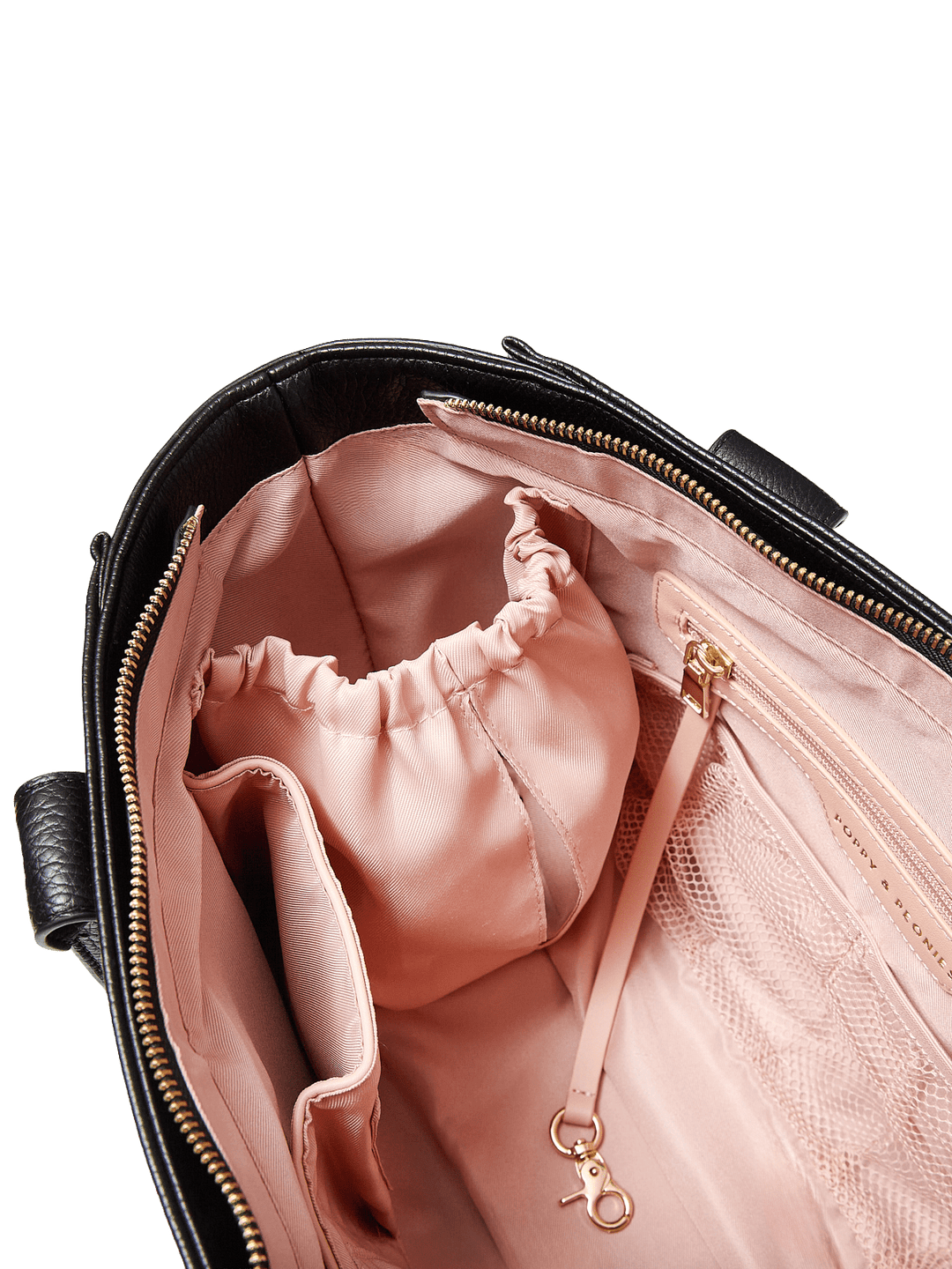 Poppy and Peonies Small Multitasker Black shown with a close-up of its interior, highlighting the blush pink lining, gathered elastic storage pocket, gold-tone hardware, and organized compartments.