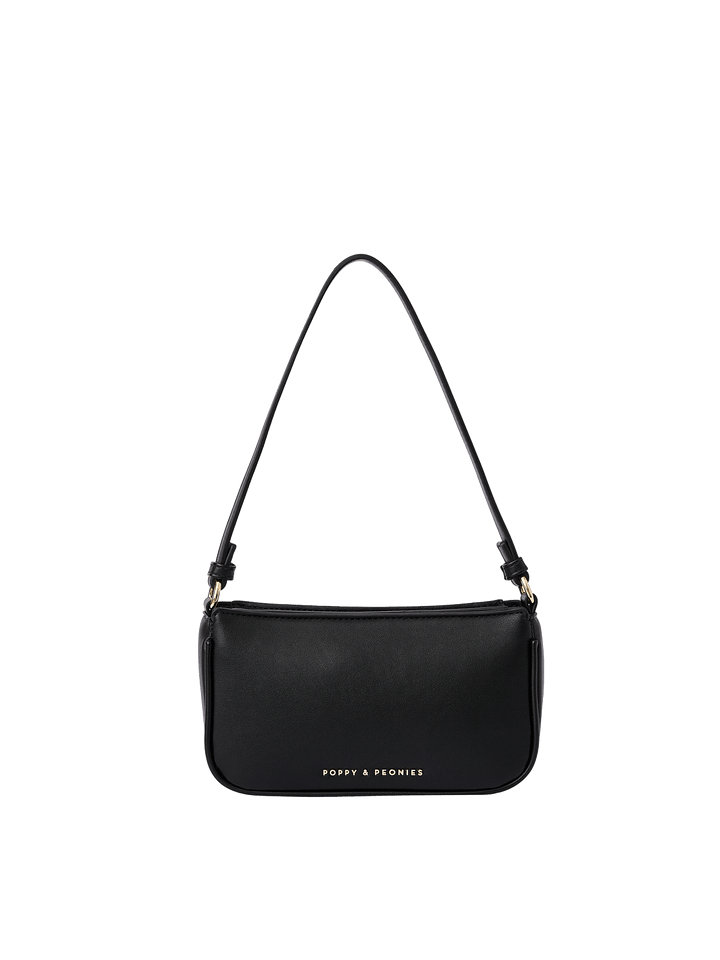 Poppy and Peonies RSVP Shoulder Bag Black featuring a sleek rectangular silhouette with rounded bottom corners, smooth black exterior, slim adjustable shoulder strap, gold-tone hardware, top zippered closure, and subtle gold Poppy and Peonies logo near the bottom.