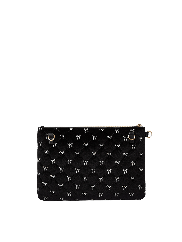 Poppy and Peonies The Clutch Trio Black Velvet featuring the large black velvet clutch displayed without its wristlet strap, highlighting its delicate white bow patterns, compact rectangular shape, and gold-tone zipper hardware.