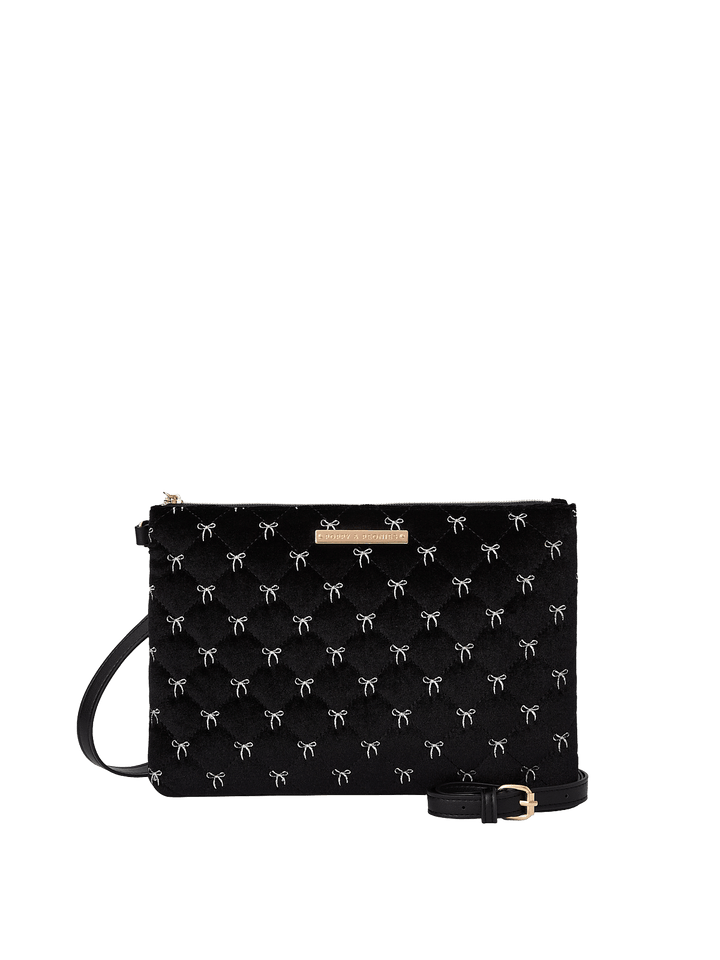 Poppy and Peonies The Clutch Trio Black Velvet displayed from the back of the large patterned clutch, showcasing its soft black velvet exterior with white bow patterns, rectangular silhouette, and attached wristlet strap.
