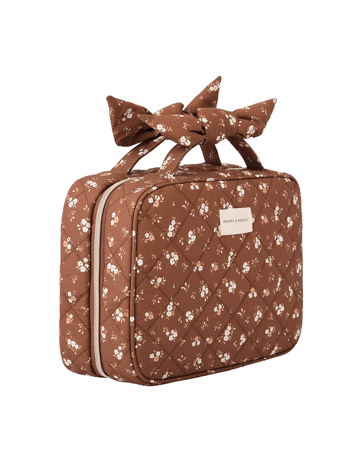 Angled side view of Small Hook Me Up Cosmetic Case in Brown Floral