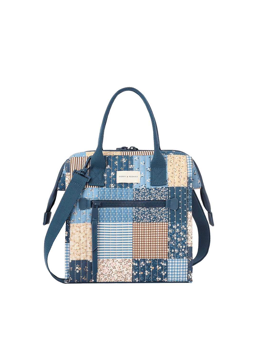 Clean product shot of the Poppy & Peonies The Lunch Bag in Navy Patchwork, showcasing the quilted patchwork exterior, top handles, front pocket, and detachable shoulder strap.