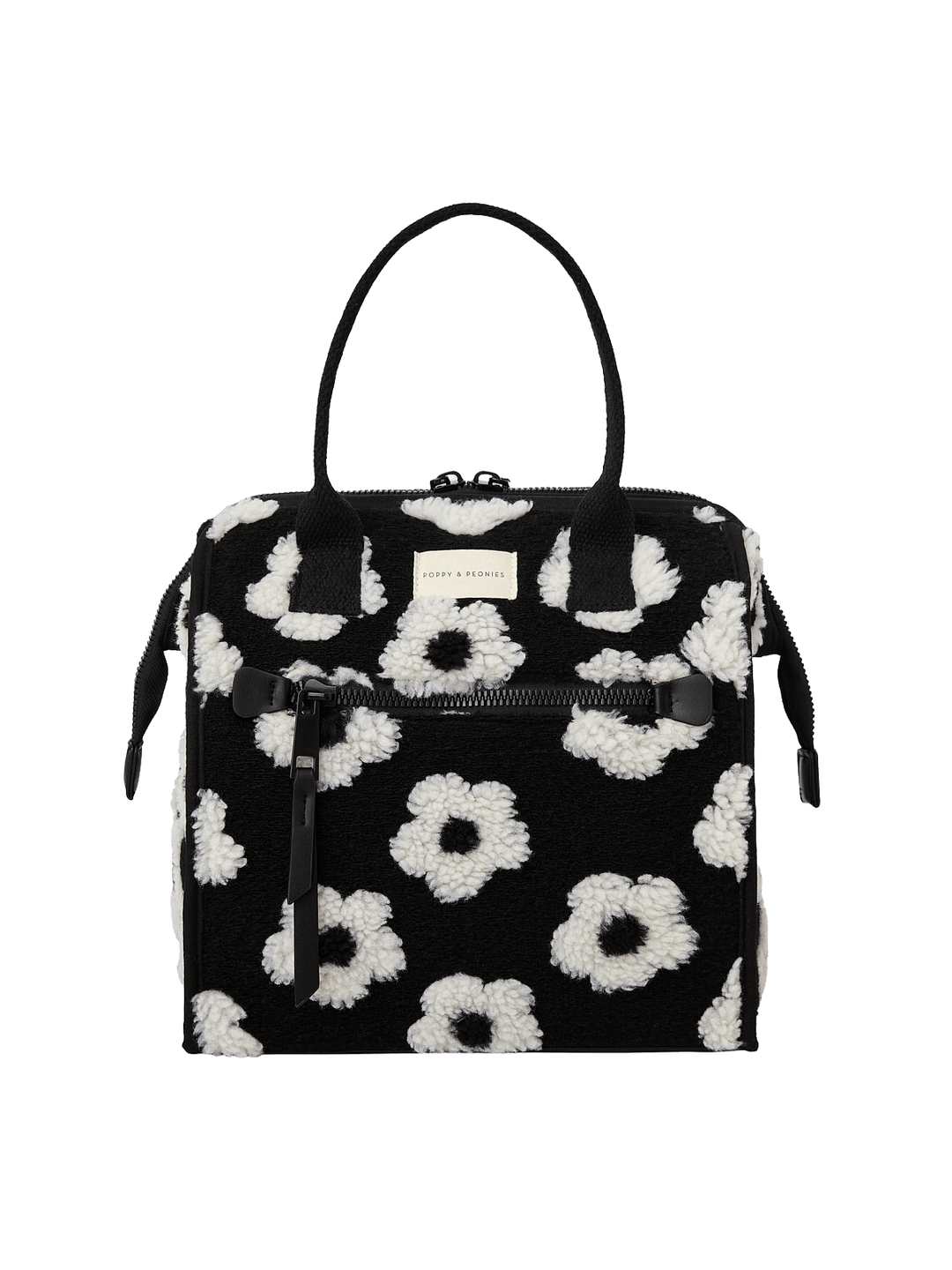 Poppy and Peonies The Lunch Bag Black Floral displayed from the front, showcasing its black exterior with white floral patterns, dual top handles, structured rectangular silhouette, and front logo plate.