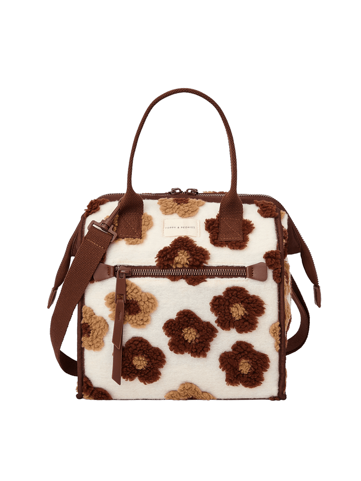 Poppy and Peonies The Lunch Bag Espresso Floral featuring a structured rectangular silhouette, cream-colored exterior with brown and espresso floral patterns, contrasting brown trim, dual top handles, detachable shoulder strap, gold-tone hardware, and front zippered pocket.