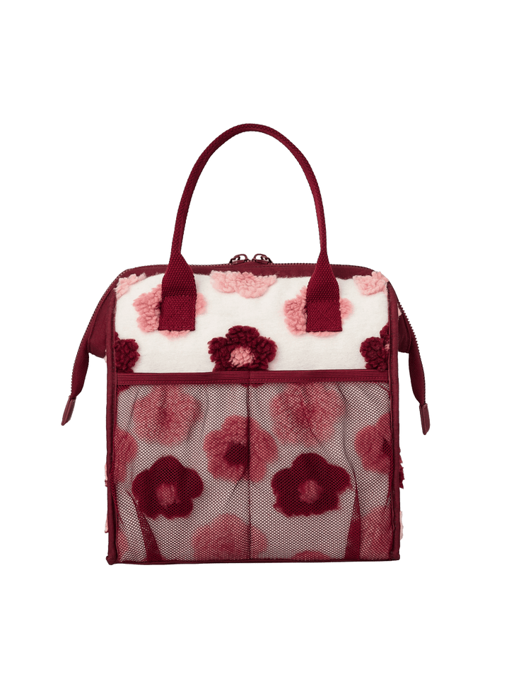 Poppy and Peonies The Lunch Bag Berry Floral displayed from the back, featuring its cream-colored exterior with pink and berry floral patterns, contrasting berry trim, dual top handles, and zippered top closure.
