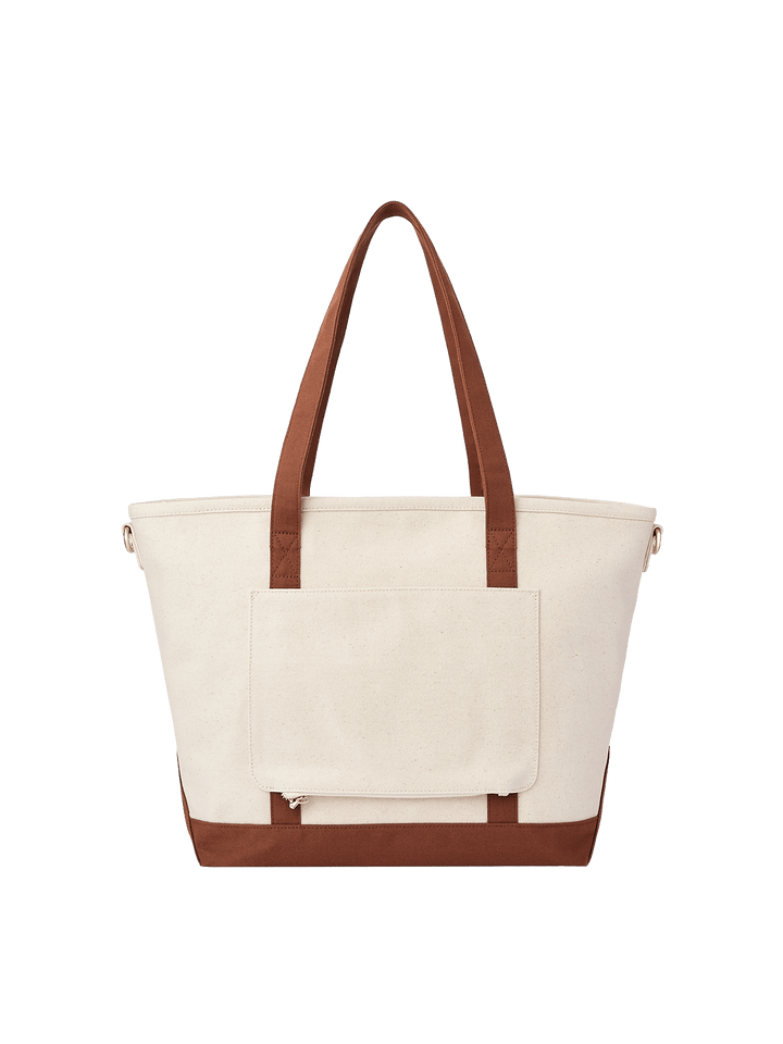 Back product view of Poppy & Peonies The Signature Tote in Chestnut, showing its cream canvas exterior, brown handles and horizontal exterior slip pocket.