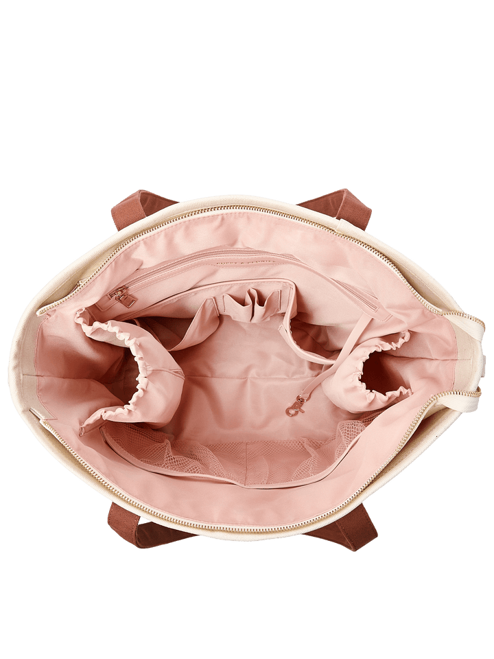 Top-down product view of Poppy & Peonies The Signature Tote in Chestnut, showing blush pink lining, elasticated organizer pockets and a spacious main compartment.