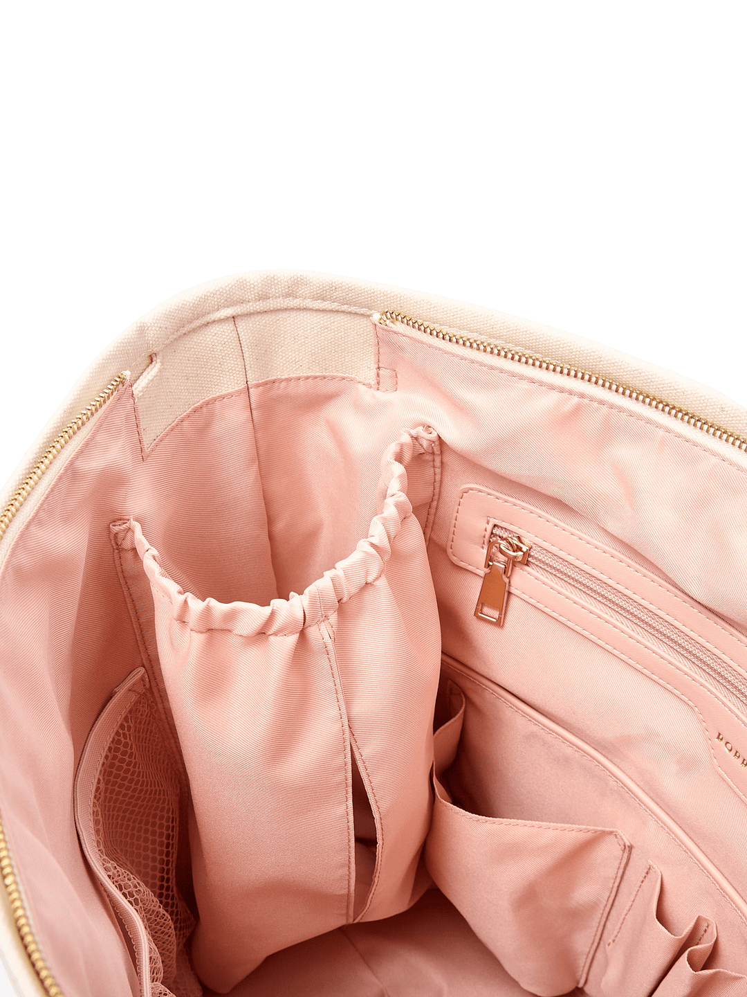 Close-up of the blush pink interior of Poppy & Peonies The Signature Tote in Chestnut, highlighting elasticated bottle holders, a zippered pocket and gold-tone hardware.