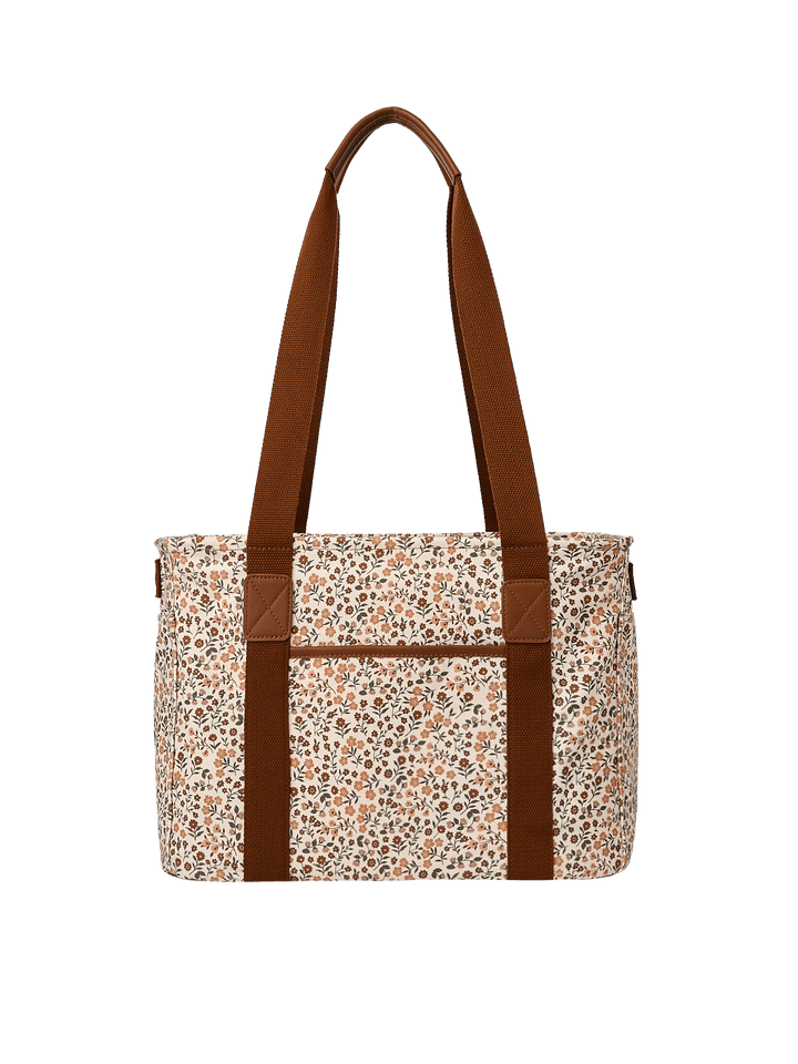 Poppy & Peonies Mini Traveller in October Floral, featuring long brown shoulder straps, a cream floral-printed canvas body, and a horizontal exterior seam detail.