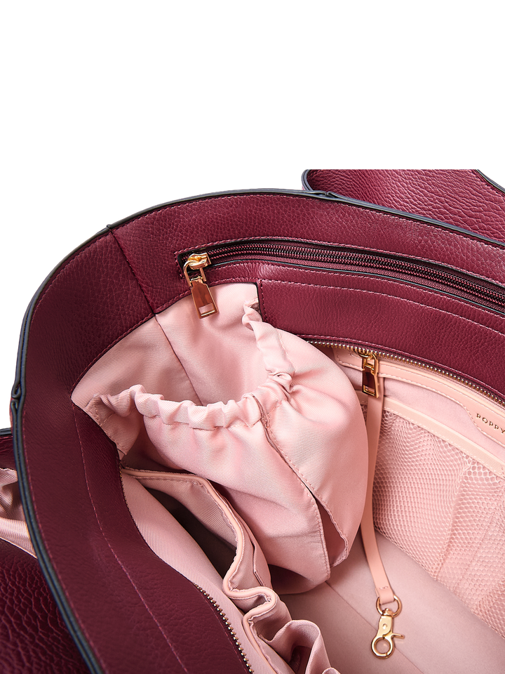 Poppy & Peonies The Companion Tote in Berry interior close-up, featuring organizational pockets and gold-tone hardware.