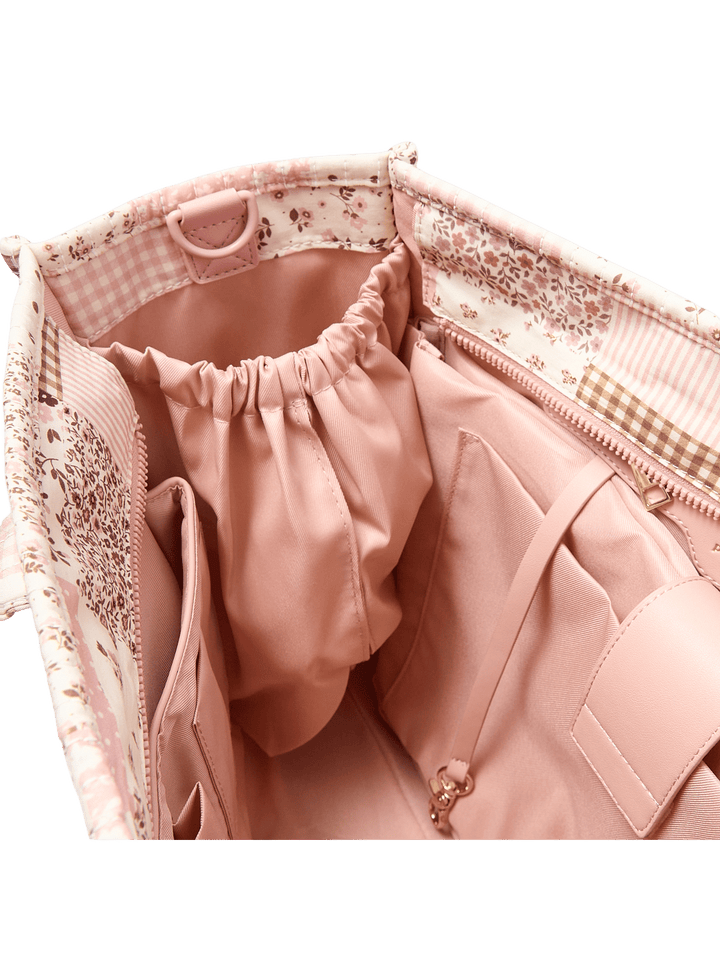 Close-up of a water bottle pocket inside a patchwork tote bag