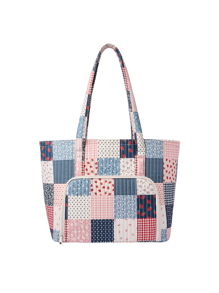 Poppy & Peonies Analog Tote in Strawberry Patchwork back view, featuring a quilted pink, blue and cream patchwork design, long shoulder straps and exterior slip pockets.