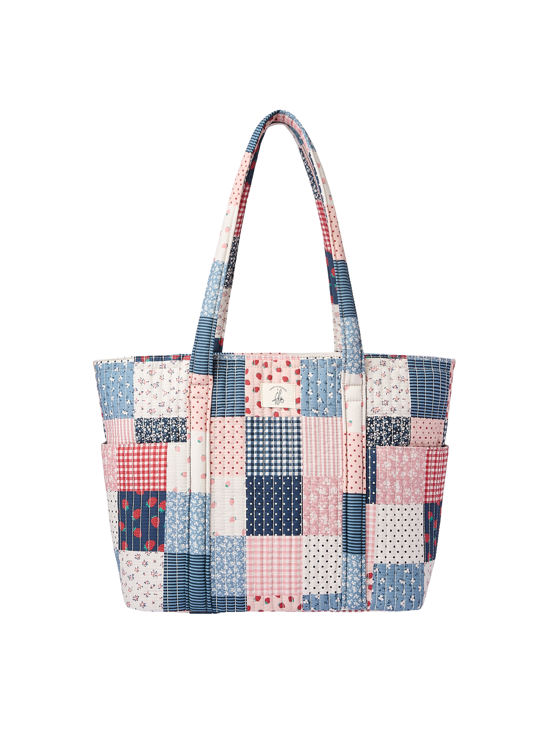 Poppy & Peonies Analog Tote in Strawberry Patchwork front view, featuring a quilted pink, blue and cream patchwork design, long shoulder straps and a large exterior zippered organizer pocket.