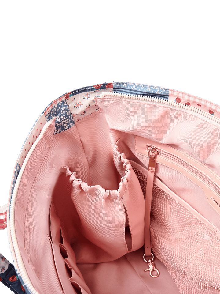 Poppy & Peonies Analog Tote in Strawberry Patchwork interior close-up, featuring blush-pink lining, elastic holders, mesh pocket, zippered pocket and key leash.