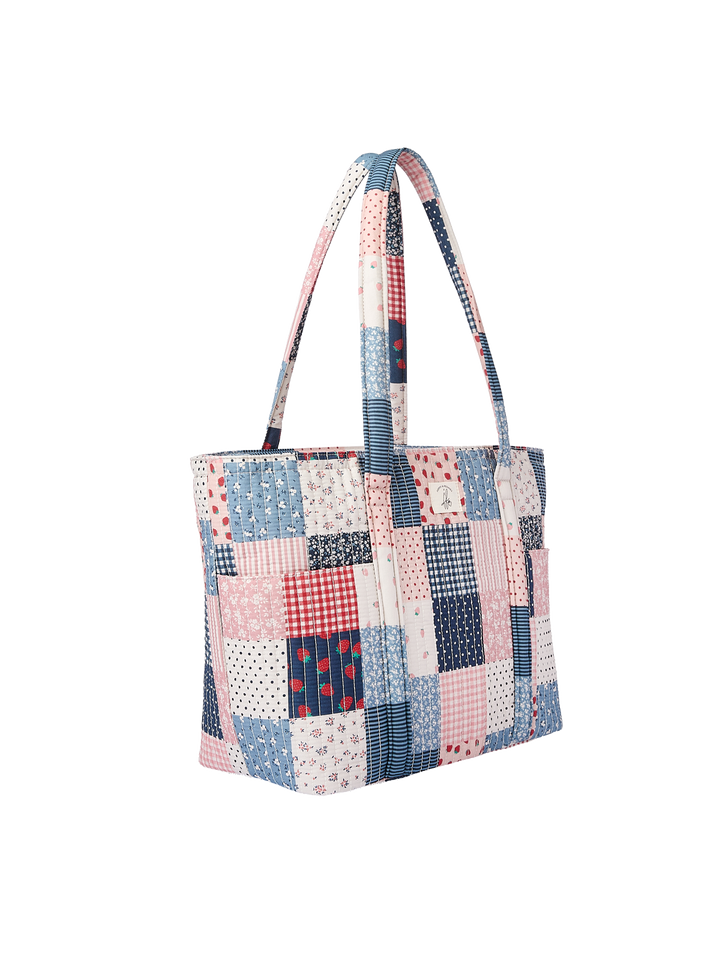 Poppy & Peonies Analog Tote Strawberry Patchwork angled side view, showing exterior side pockets and long shoulder straps.