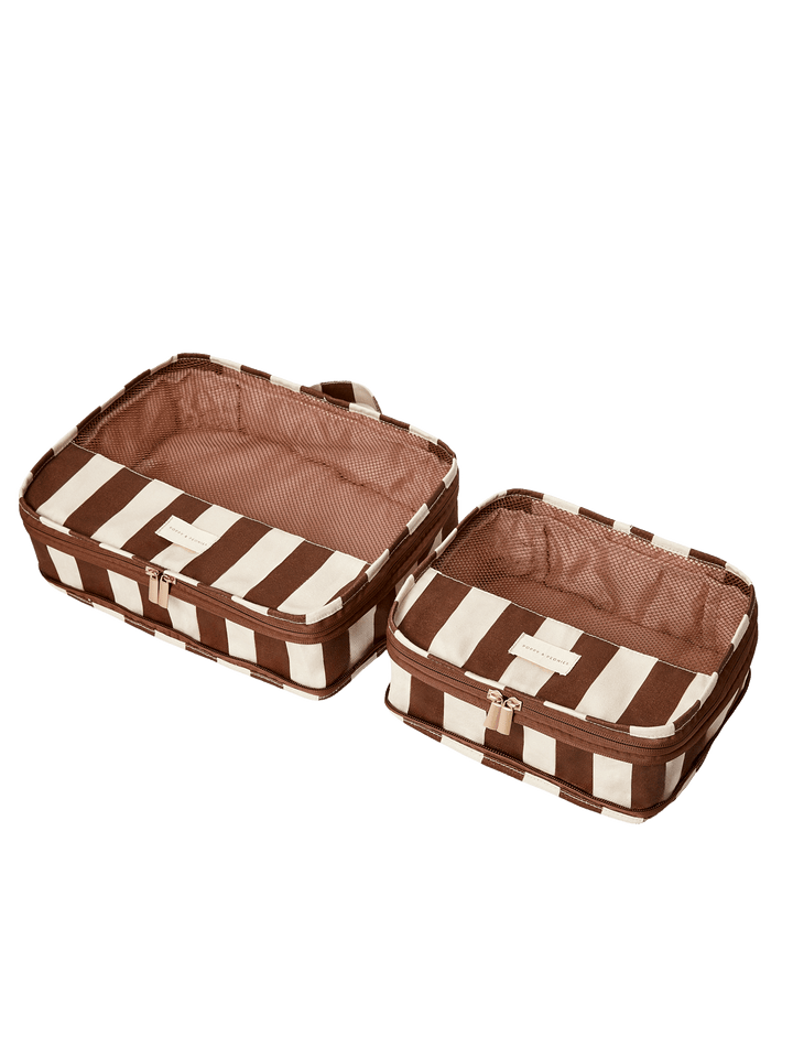 Two brown and white striped packing cubes