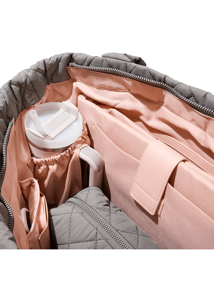 Inside of a grey quilted tote bag