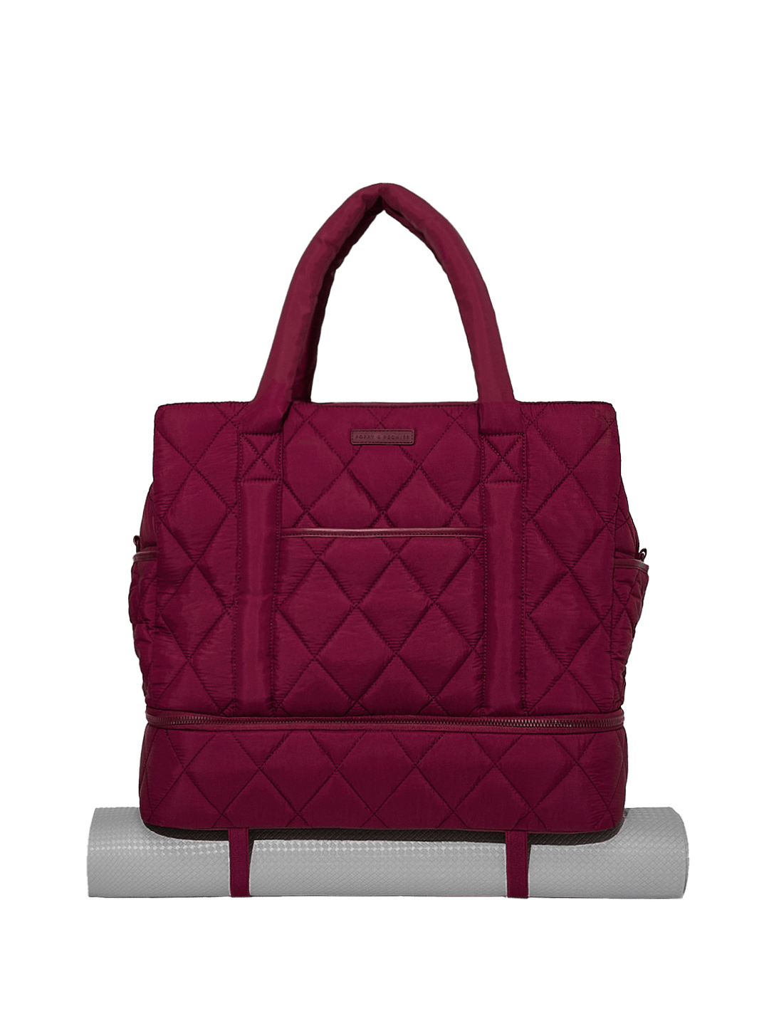 Quilted berry travel bag on a white background