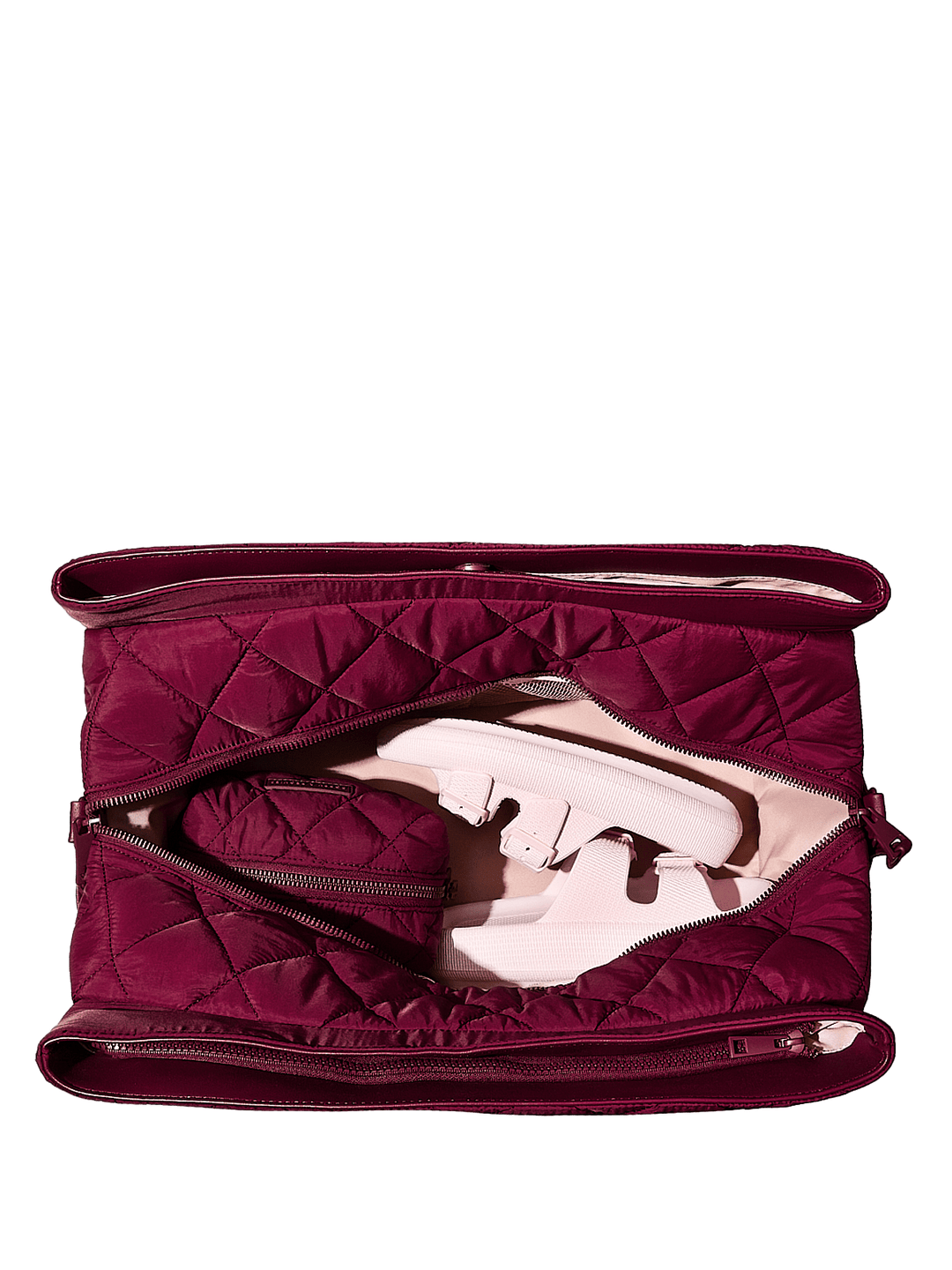 Berry quilted bag with a white sandal inside on a transparent background