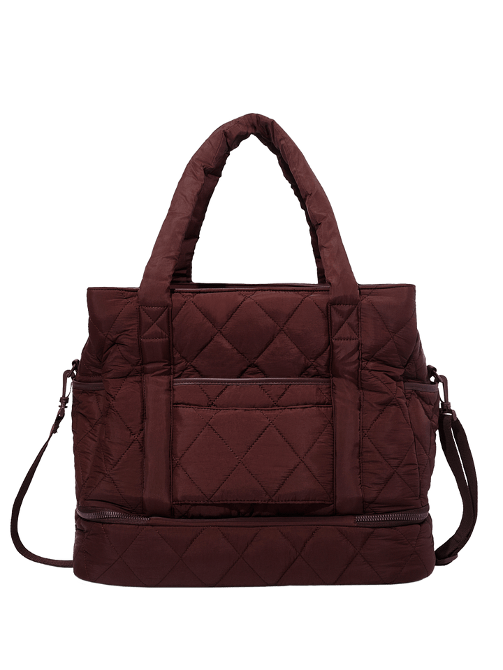 Brown quilted travel bag with a shoulder strap