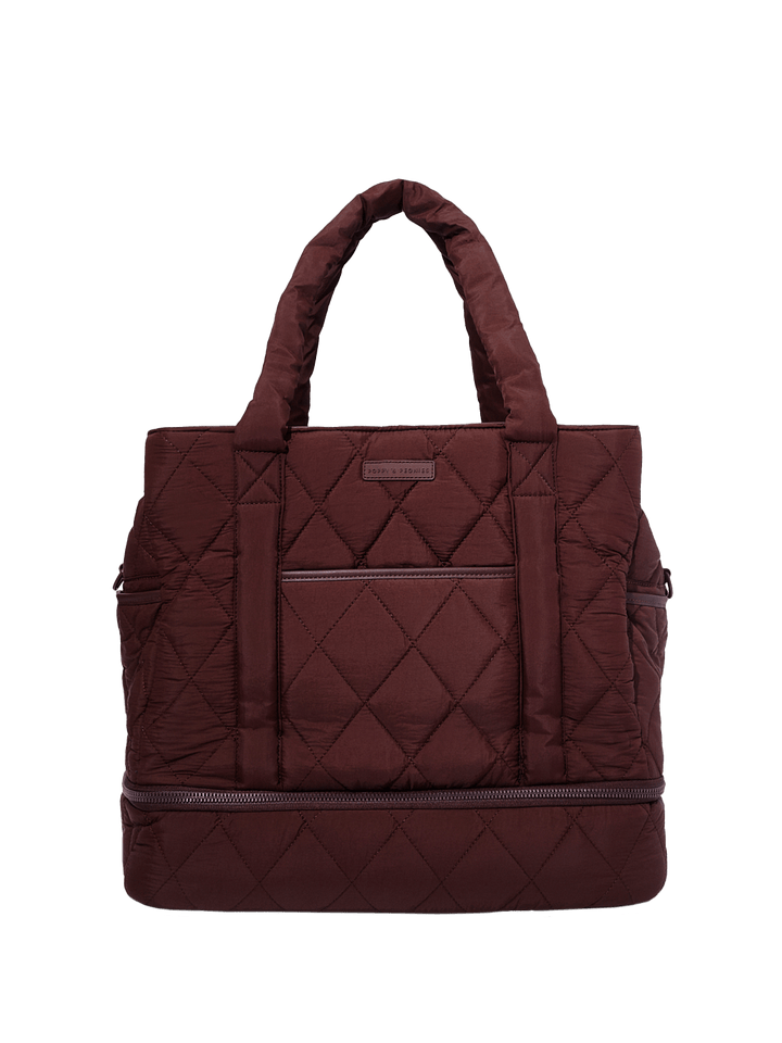 Quilted brown travel bag on a transparent background