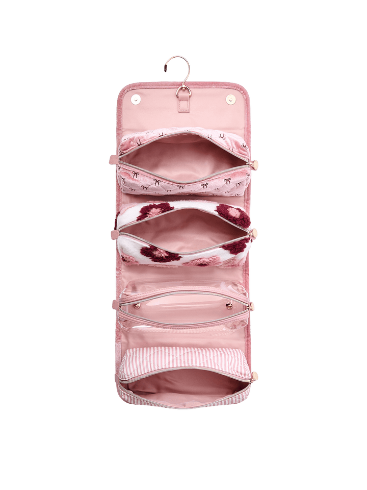 Poppy and Peonies The Glam Squad Cosmetic Case Pink Velvet displayed fully open from the front, showcasing its blush pink interior with multiple zippered compartments, transparent storage pockets, and spacious sections for cosmetics and travel essentials.
