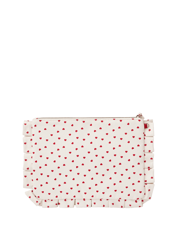 White clutch with red heart pattern