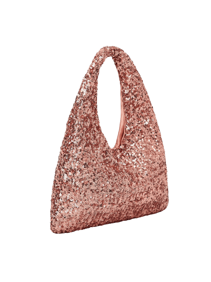 Poppy and Peonies The Jingle Belle Shoulder Bag Rose Gold displayed at a three-quarter angle, highlighting its soft triangular shape, sparkling rose gold sequin exterior, integrated shoulder handle, and slim side profile.