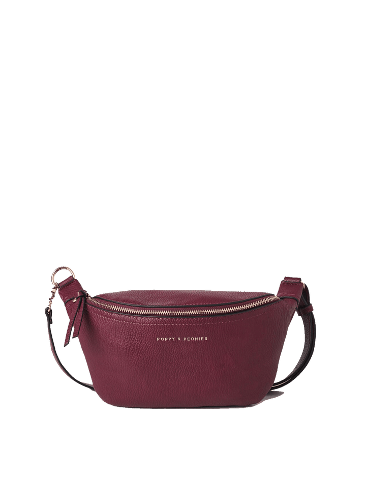 Poppy and Peonies The Sidekick Berry crossbody bag featuring a curved silhouette, textured berry exterior, gold-tone zipper, adjustable strap, and gold logo on the front.