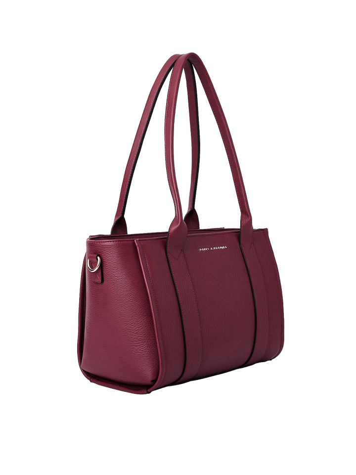 Side profile of the Small Multitasker in Berry showing spacious tote design