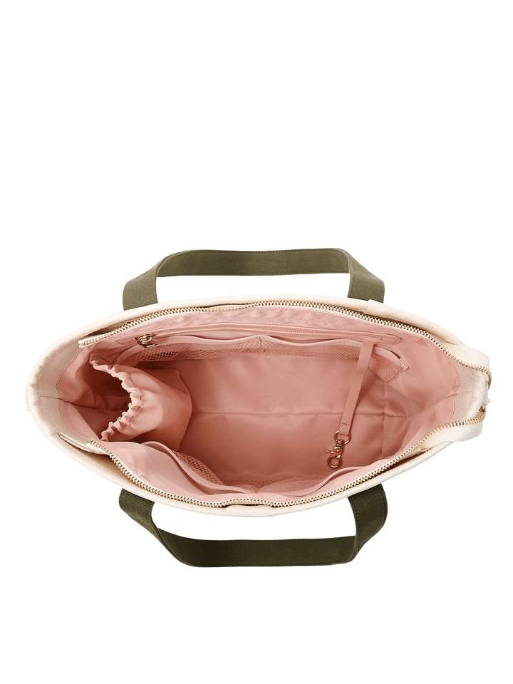 Poppy & Peonies The Small Signature Tote in Olive, overhead view of the open bag revealing its blush-pink lining, interior pockets, and organized storage space.