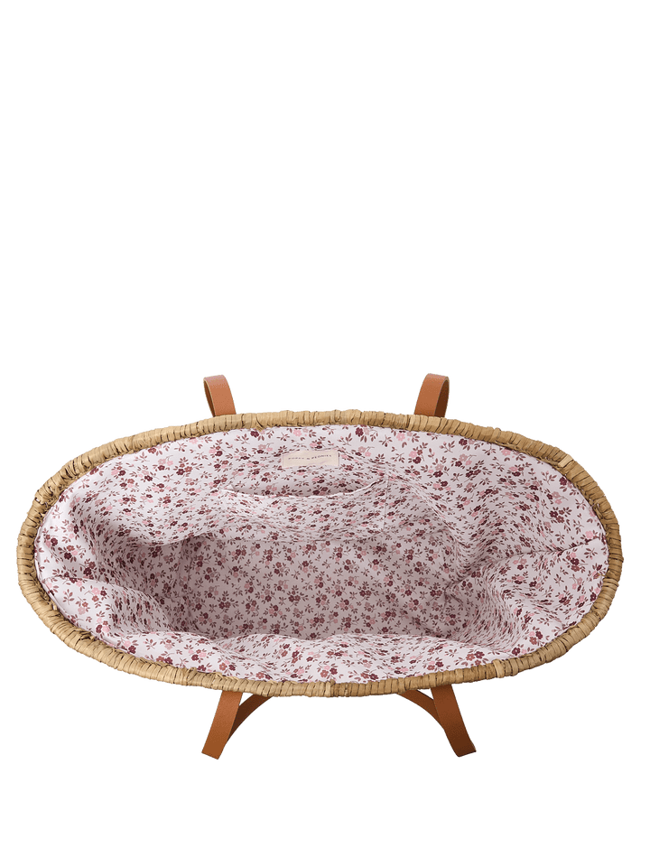 Interior of a straw tote bag with a floral lining