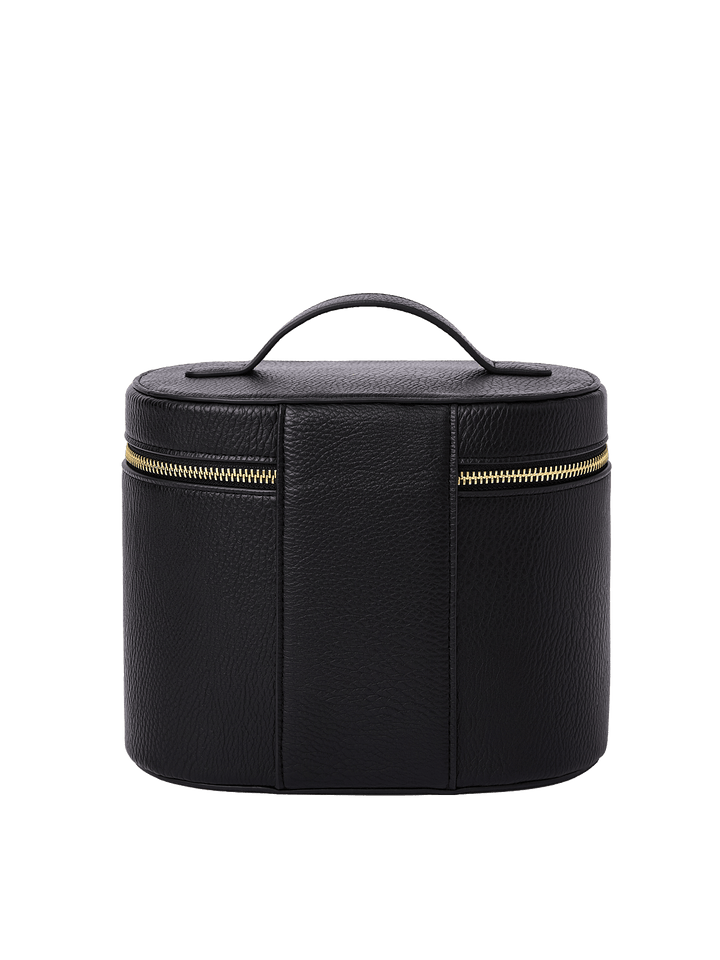 Poppy and Peonies The Vanity Case Black displayed from the back, featuring its textured black exterior, structured rounded silhouette, top carrying handle, vertical seam detailing, and horizontal gold-tone zipper closure.