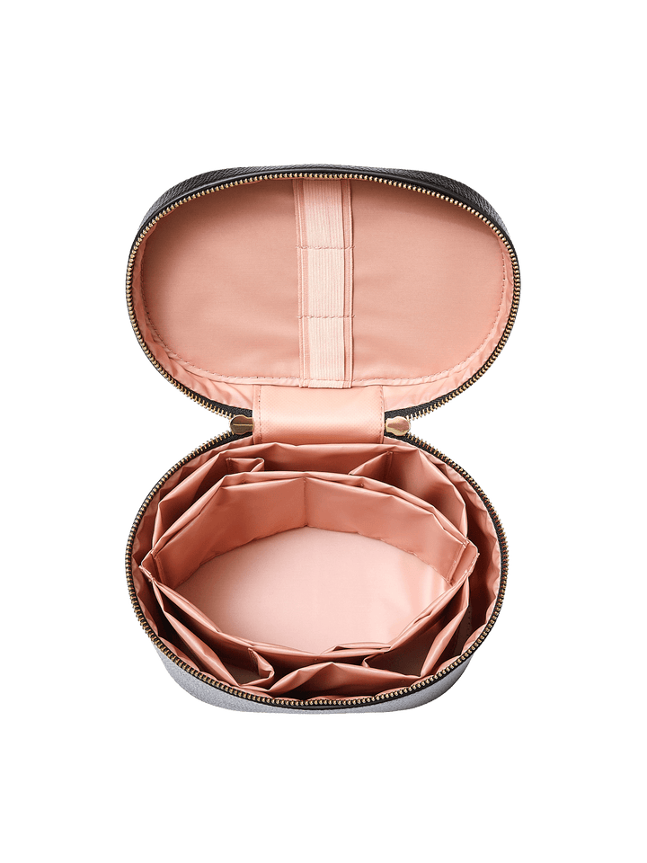 Poppy and Peonies The Vanity Case Black displayed fully open from above, revealing its blush pink interior with multiple storage compartments, elastic organizers, and a spacious main compartment for beauty essentials.