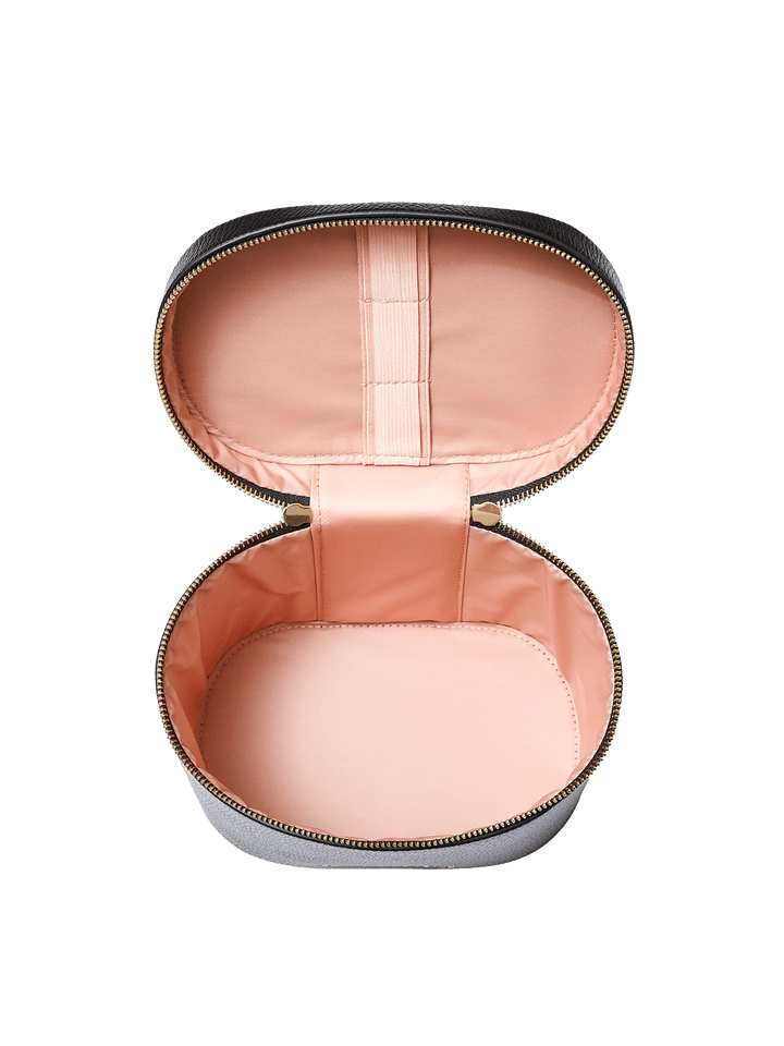 Poppy and Peonies The Vanity Case Black displayed fully open from the front, showcasing its blush pink lining, interior elastic strap, spacious storage compartment, and gold-tone zipper hardware.