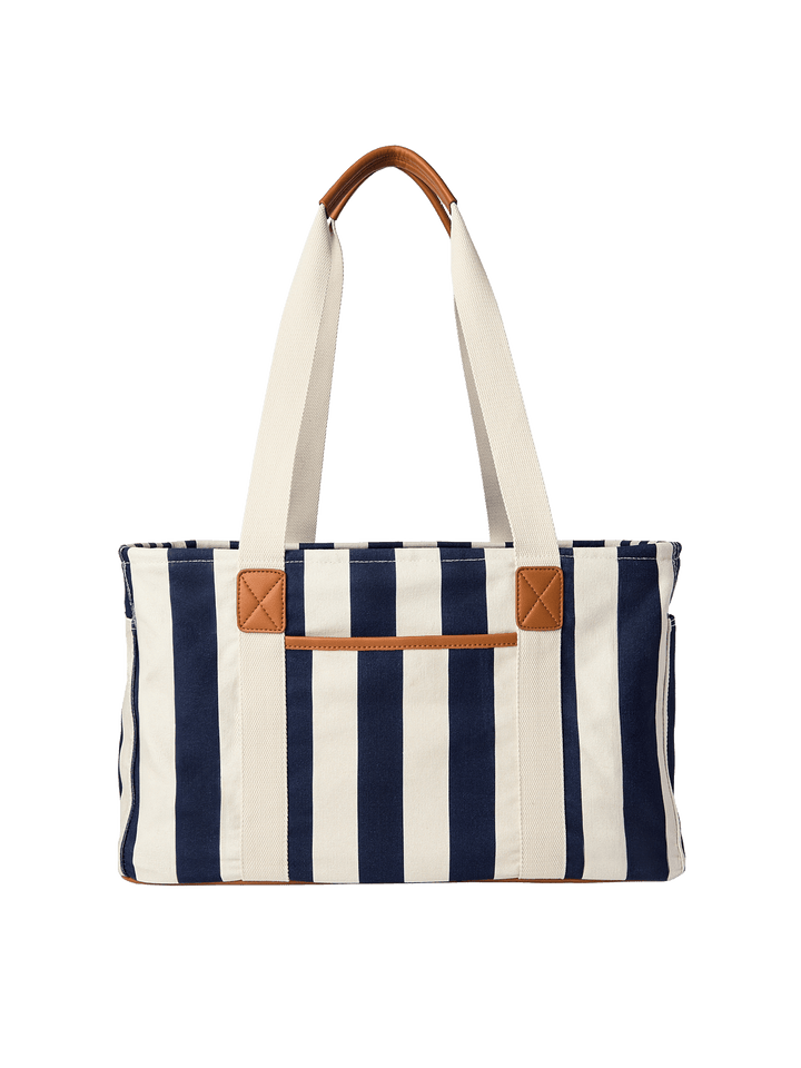 Navy and white striped tote bag with brown leather accents