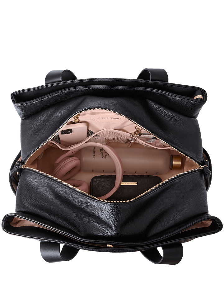 Interior of Mini Voyager tote in Black showing triple-opening compartments and organizer pockets.