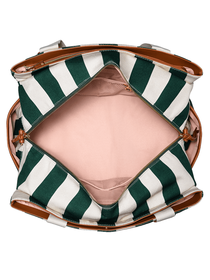 Open travel bag with green and white stripes and a pink lining 
