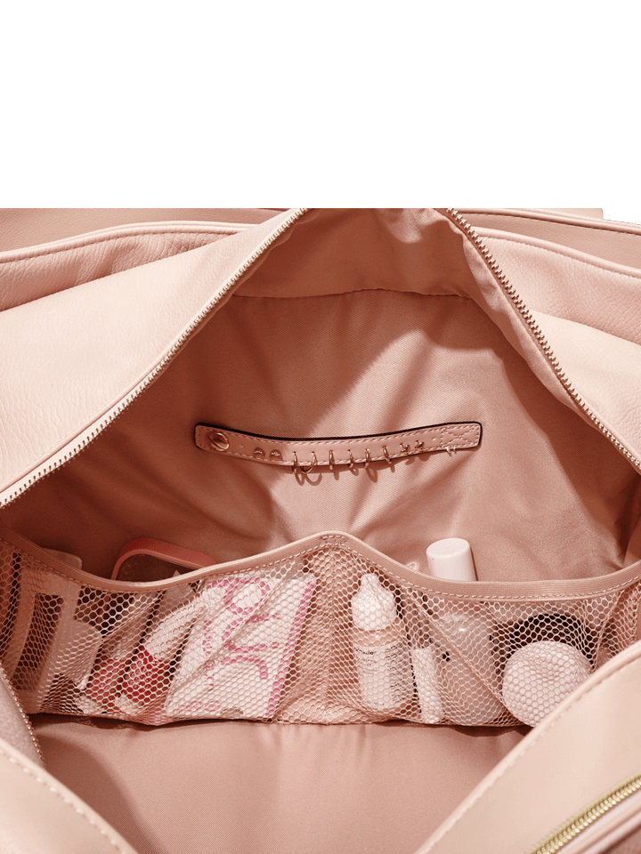 Open blush bag with mesh pockets and a jewelry tap