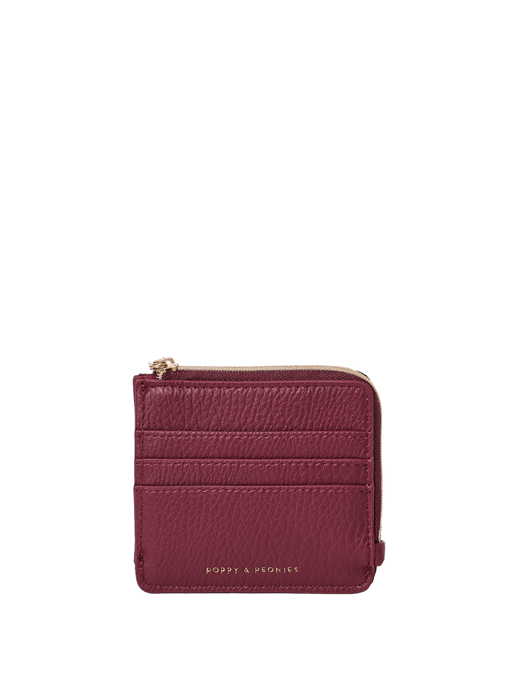 Berry coloured wallet with gold zipper on a transparent background