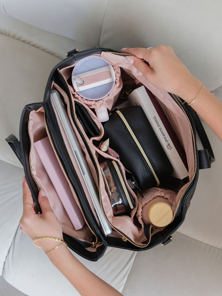 Overhead view of the Poppy & Peonies Double Duty Tote in Black packed with everyday essentials and organized interior compartments.