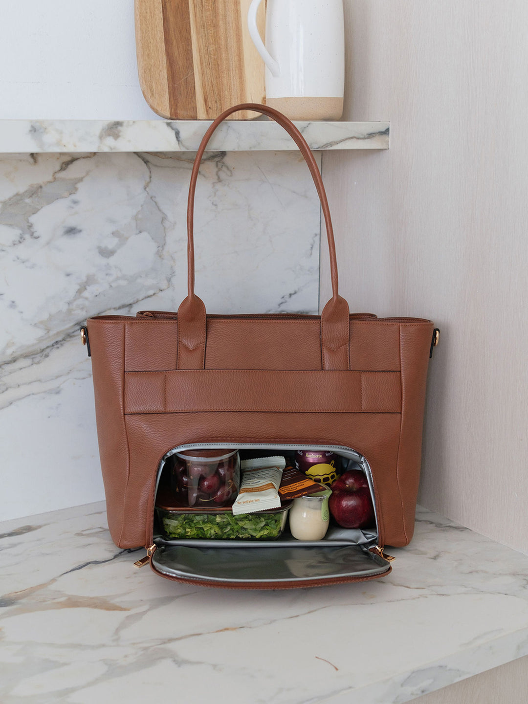 Poppy & Peonies Double Duty Tote in Chestnut showcasing the insulated lunch compartment with lunch and snacks.