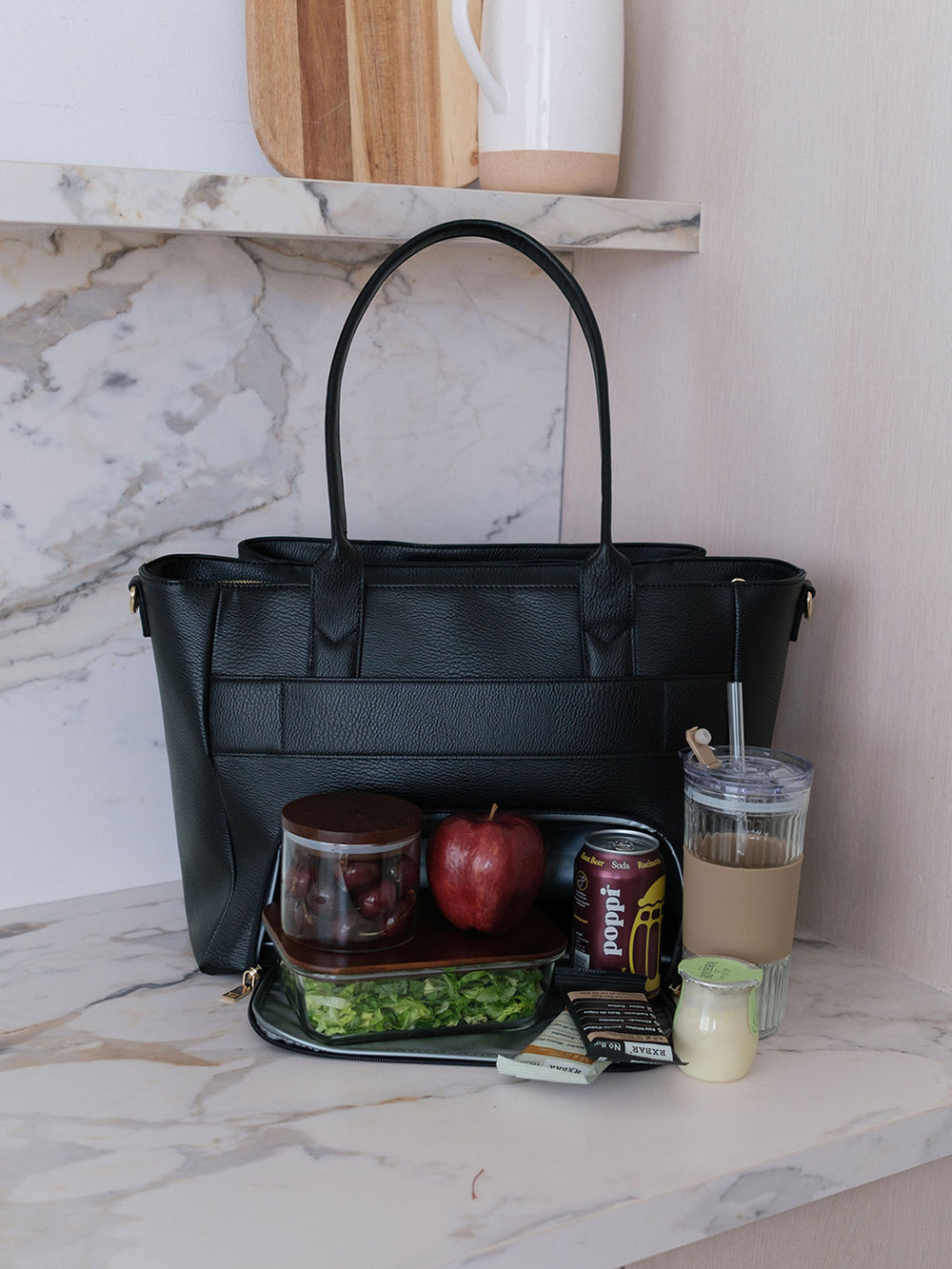 Poppy & Peonies Double Duty Tote in Black styled with lunch, snacks and iced coffee, showcasing everyday carry capacity.