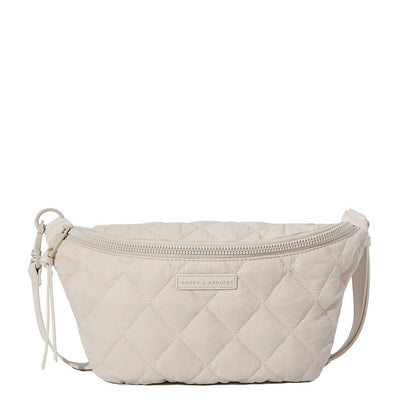 front of a cream quilted Poppy and Peonies crossbody bag