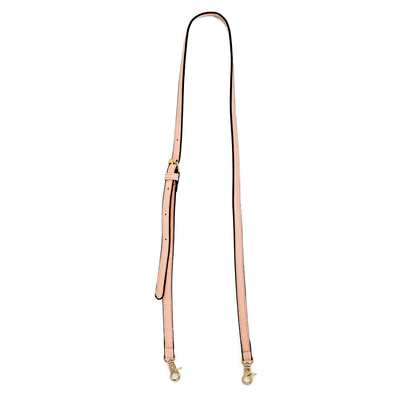 A blush pink crossbody strap with metal hardware.